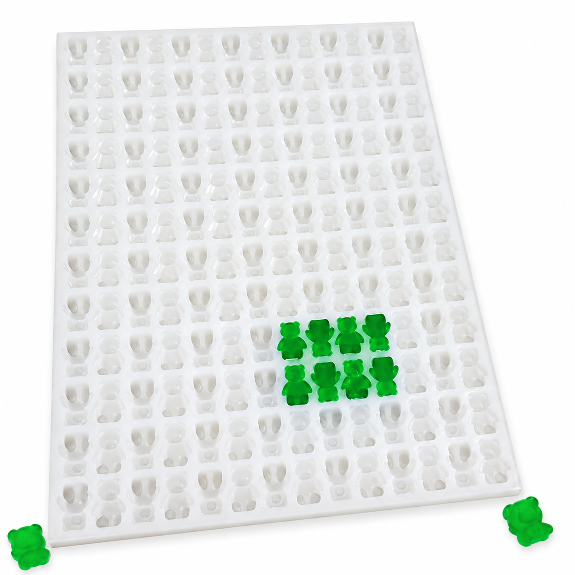 Gummy bear silicone mold with emerald green gummy bears ready for molding and demolding