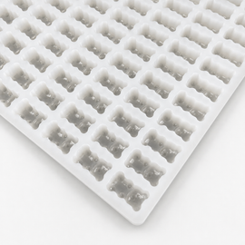 Close-up of a 2.3mL gummy bear silicone mold with 230 cavities on a clean white background