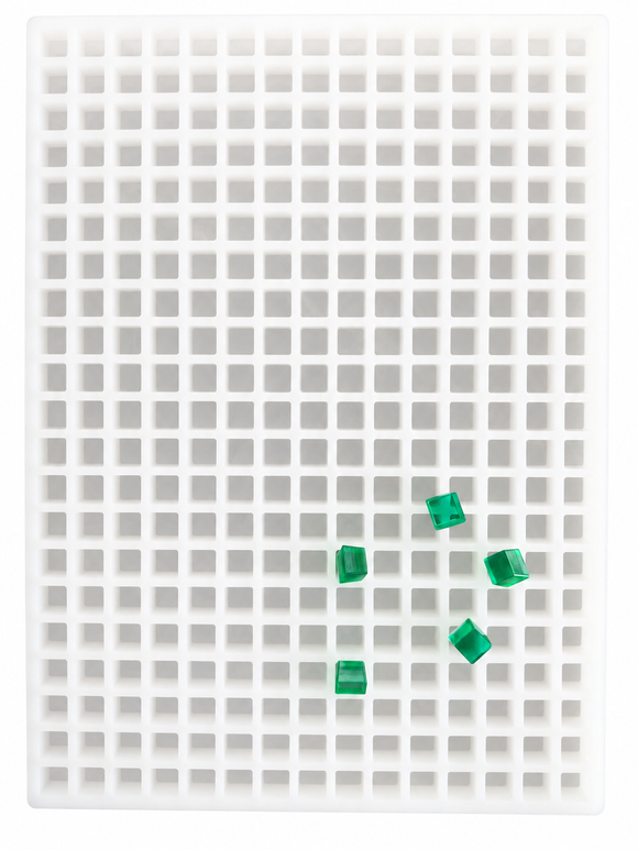 Top view of the 2.625mL square gummy mold with 266 cavities and translucent emerald green square gummies on a white background