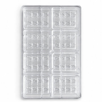 Clear custom polycarbonate chocolate mold with 64 tree-shaped cavities